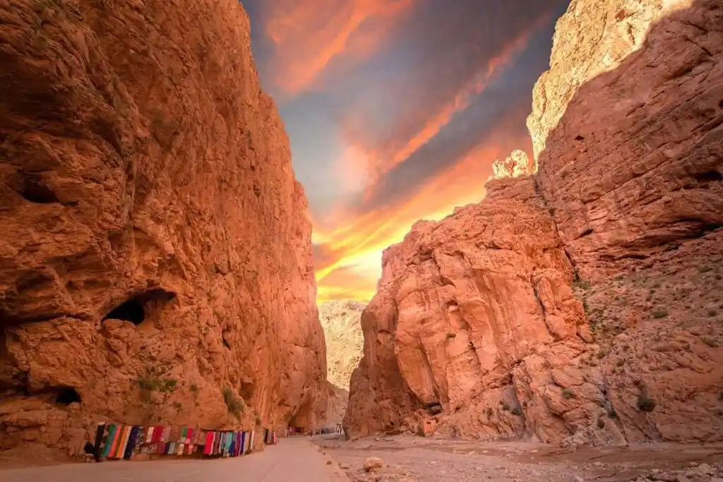 Sunset golden light painting Dades Gorges red canyon walls warm colours