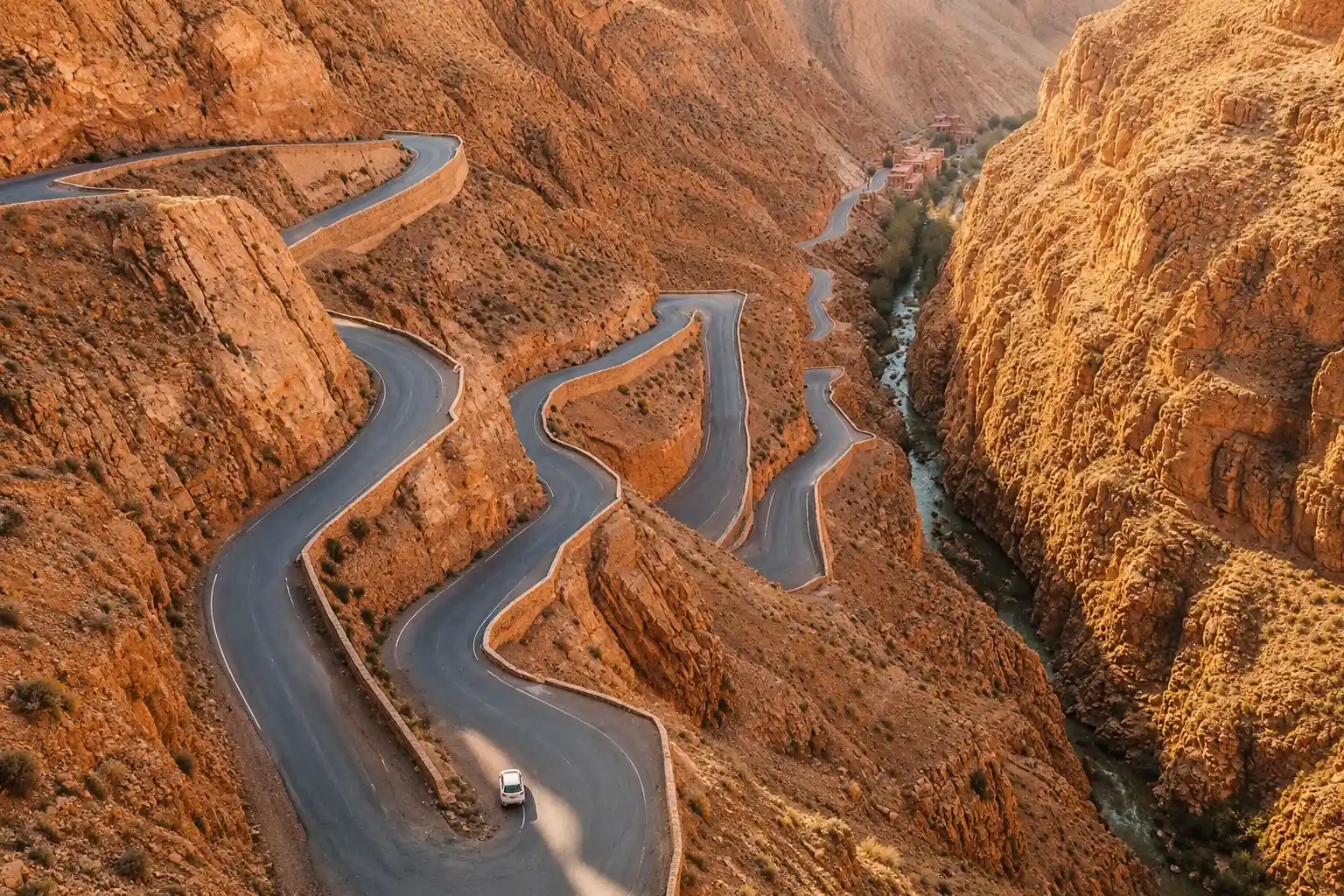 Dades Valley gorge aerial view winding road red sandstone canyon Morocco